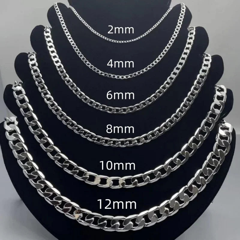 Six silver-toned chain necklaces displayed on black jewelry busts, labeled with thickness sizes 2mm, 4mm, 6mm, 8mm, 10mm, and 12mm against a light gray background.