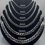 Six silver-toned chain necklaces displayed on black jewelry busts, labeled with thickness sizes 2mm, 4mm, 6mm, 8mm, 10mm, and 12mm against a light gray background.