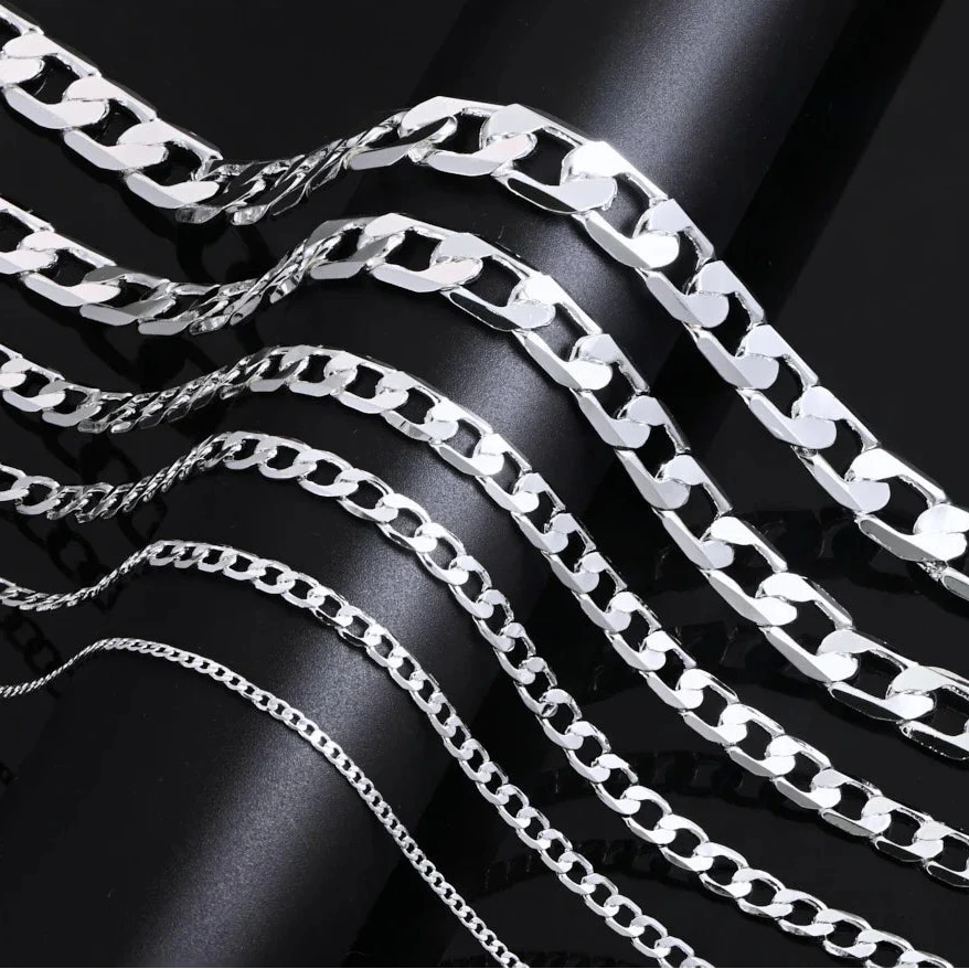 Silver chain necklace on a black background 